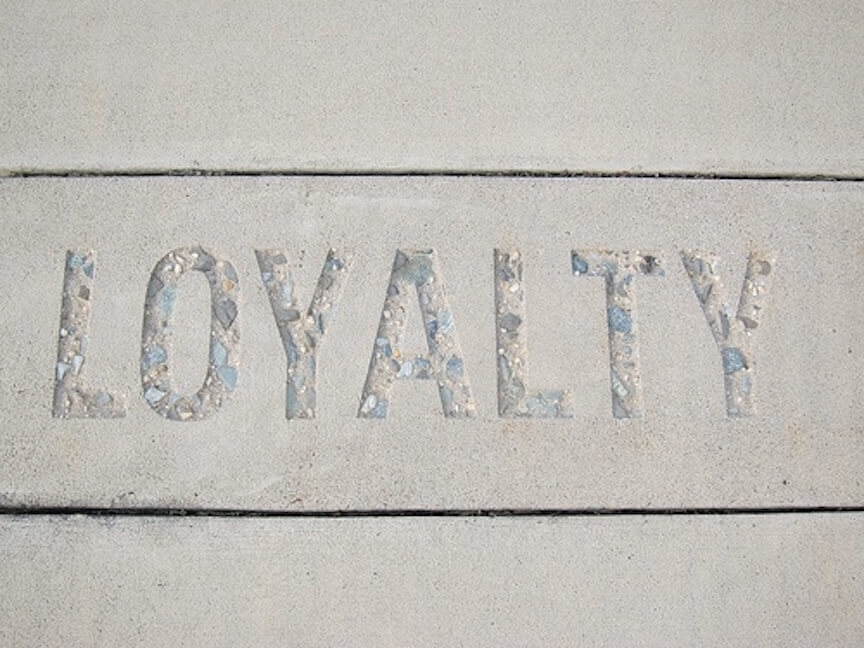 The word 'loyalty' spelled in concrete.