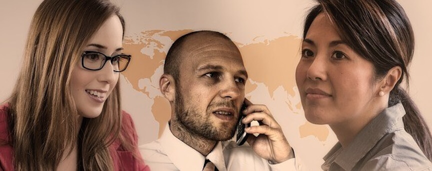 Three business professionals, two women and one man on the phone, symbolizing teamwork and global business management.