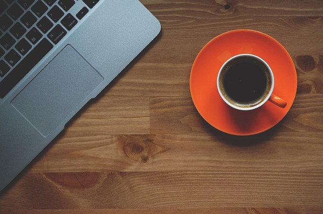 laptop and coffee on table