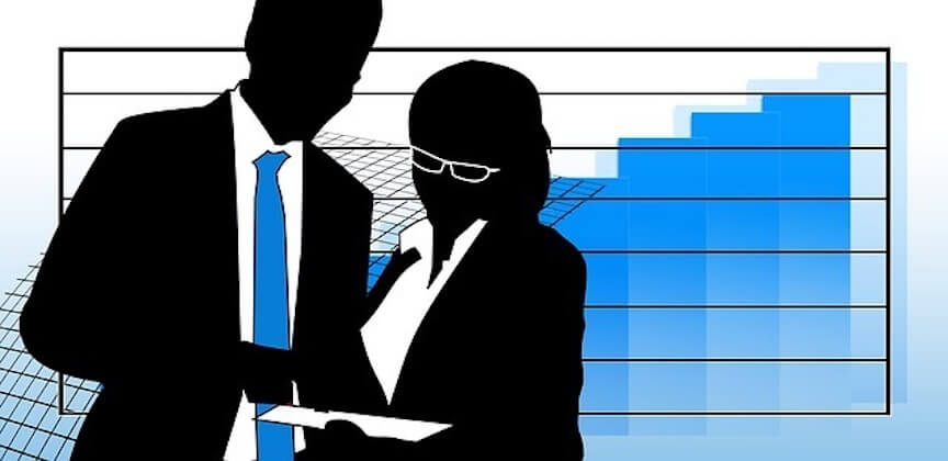 Silhouettes of two business professionals reviewing documents in front of a rising blue bar chart symbolizing growth and success.