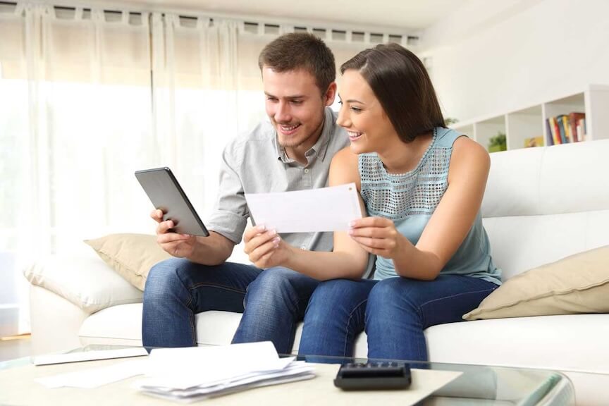 A husband and wife reviewing an e-reader.