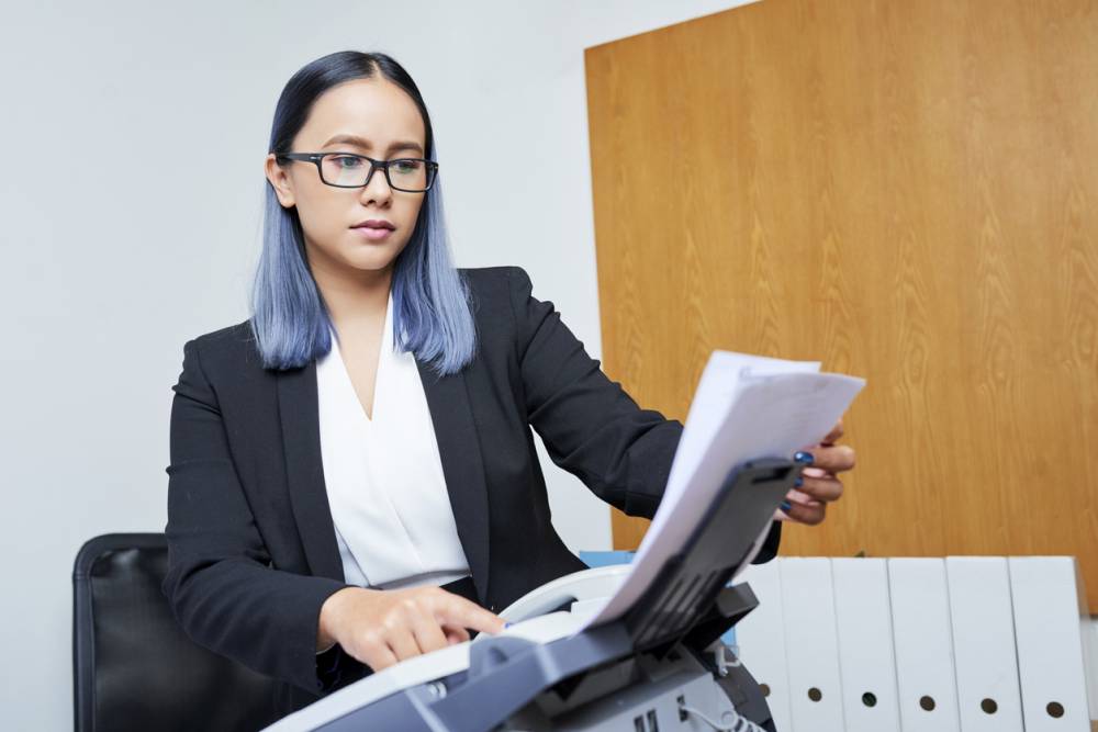 businesswoman receiving fax