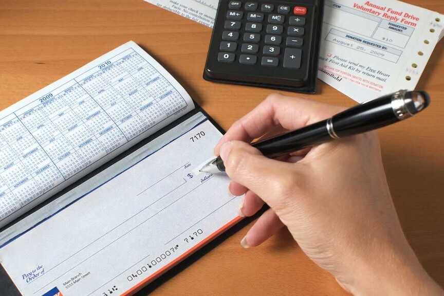 A picture of a check with a date written on it, representing its expiration