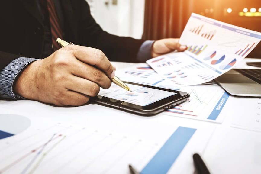 A picture of a business owner and accountant working on tax documents