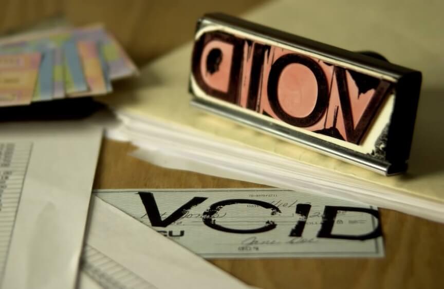 A picture of a check with the word "VOID" written across it
