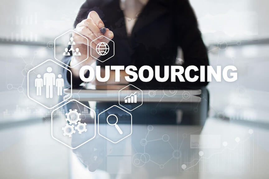 A picture of a business owner and a third-party service provider discussing accounts payable management
