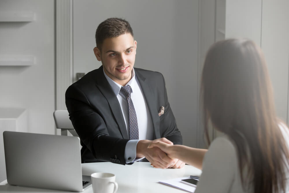 Man and Woman Shaking Hands