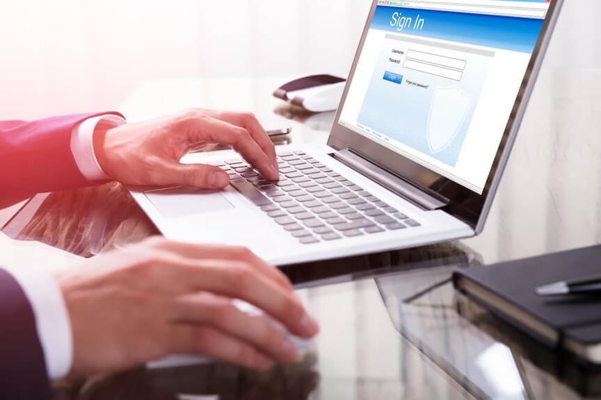 A graphic of a digital check being sent from a computer to a phone