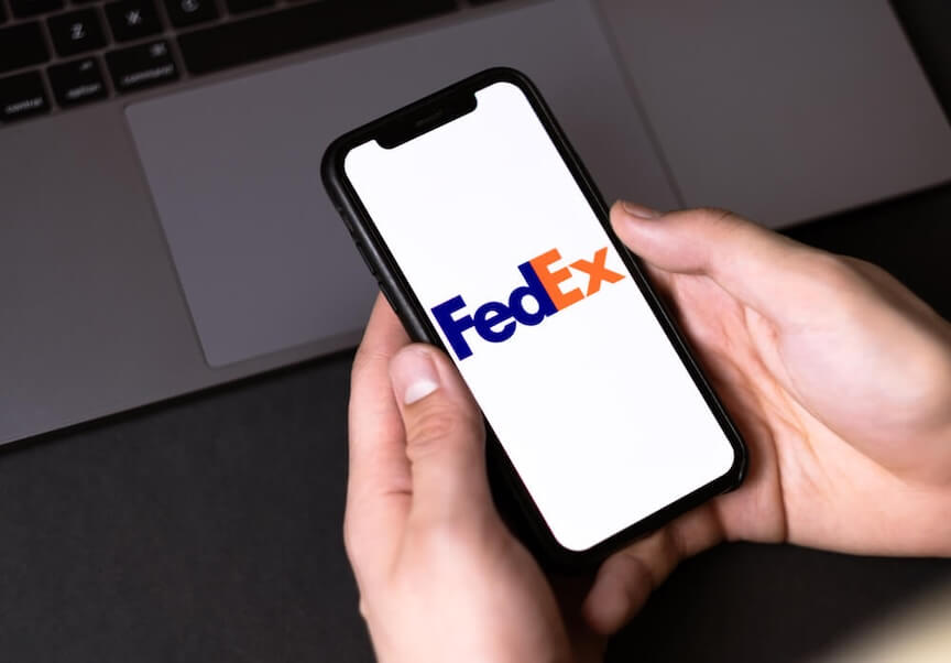 A picture of a FedEx delivery truck with a question mark over it
