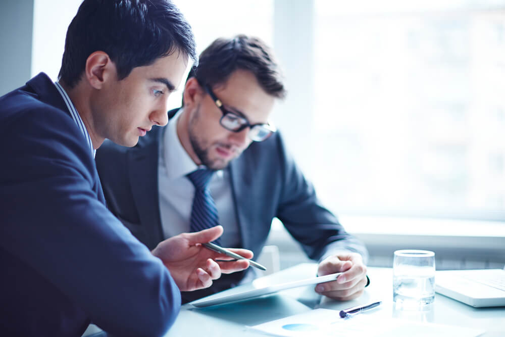 Two Businessmen Looking at the Tablet