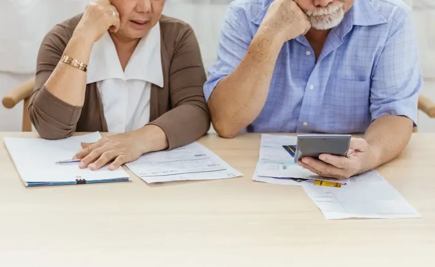 An image showing two people working on an ACH payment