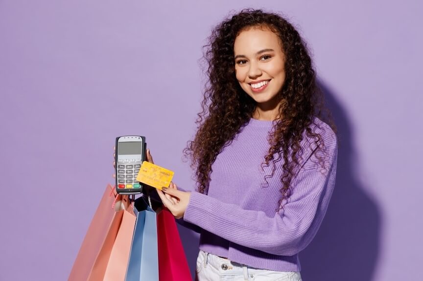 A woman holding up a cell phone