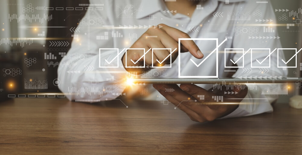 Businessman Working With Tablet Checking Mark Up On The Check Boxes