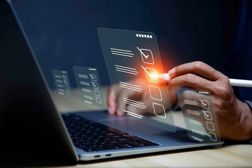 A graphic showing a digital check on a laptop screen with a checkmark for security