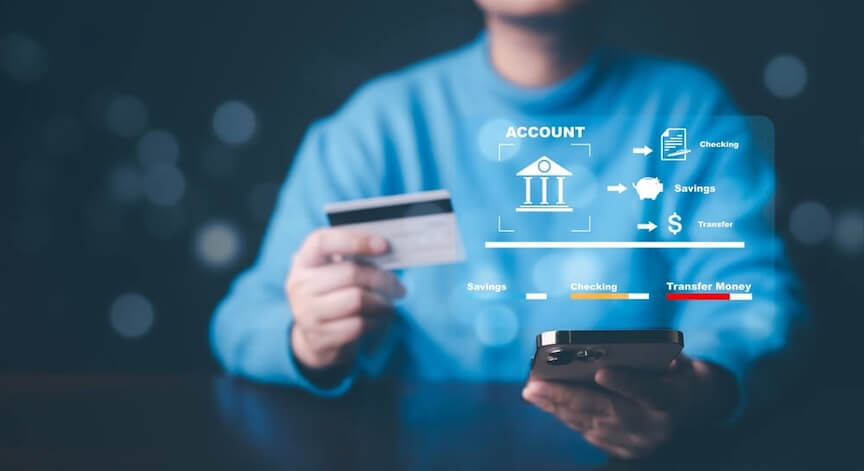 A man holding up a bank card.